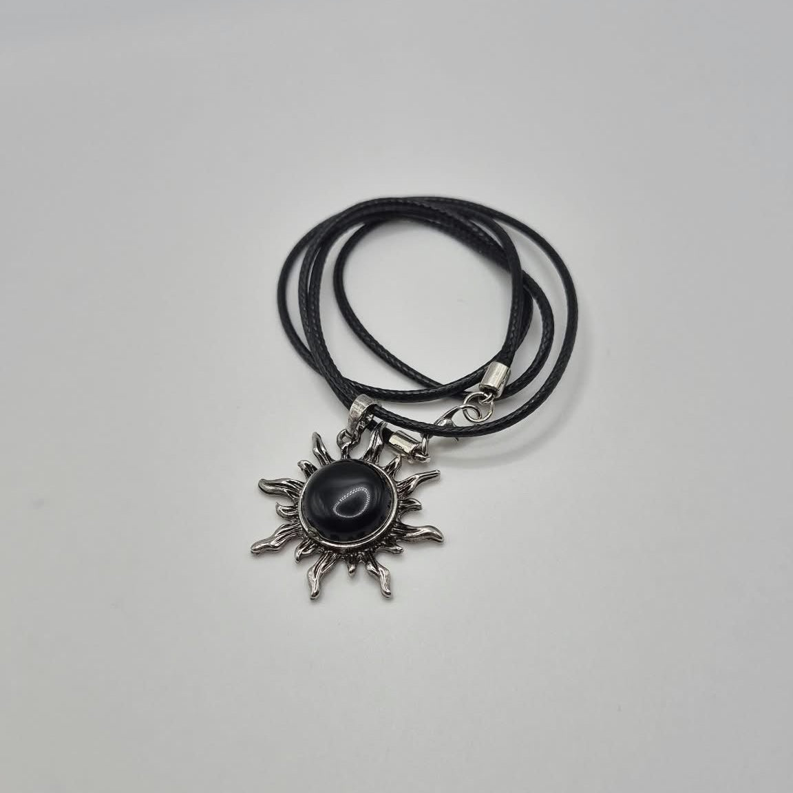 Black Sunburst Pendant Necklace with Cord